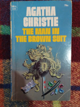 The man in the brown suit